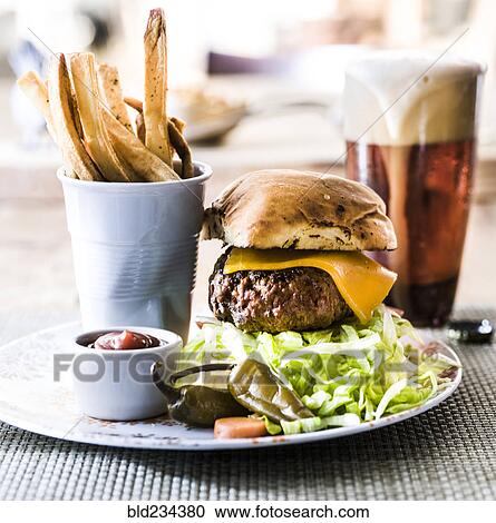 Stock Image - "Hamburger, french fries and beer". Fotosearch
