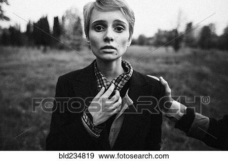 Stock Photo - Hand comforting fragile Caucasian woman. Fotosearch