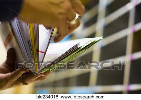 Hands flipping through mail View Large Photo Image Stock Photo - Hands flipping through mail. Fotosearch