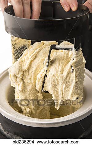 Hands lifting homemade ice cream View Large Photo Image Picture - Hands lifting homemade ice cream. Fotosearch