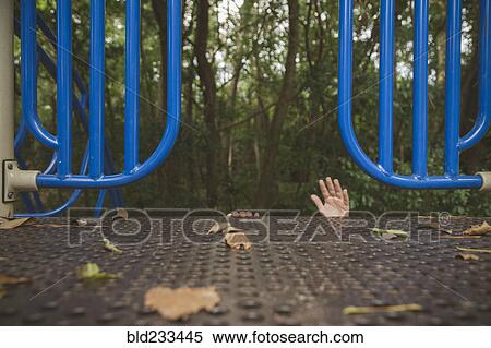Stock Photography - Hands of Hispanic girl reaching on playground. Fotosearch