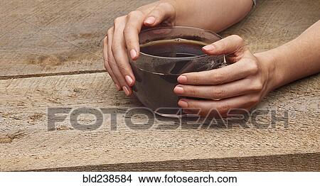Hands of woman holding coffee cup View Large Photo Image Picture - Hands of woman holding coffee cup. Fotosearch