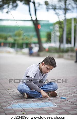 Hispanic boy drawing laptop with chalk on sidewalk View Large Photo Image Stock Image - Hispanic boy drawing laptop with chalk on sidewalk. Fotosearch