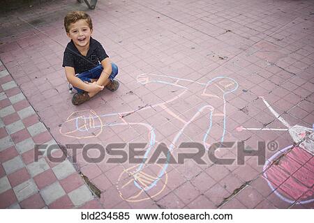 Hispanic boy with chalk drawing on sidewalk View Large Photo Image Stock Photography - Hispanic boy with chalk drawing on sidewalk. Fotosearch