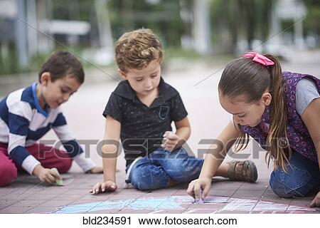 Hispanic boys and girl drawing with chalk on sidewalk View Large Photo Image Stock Image - Hispanic boys and girl drawing with chalk on sidewalk. Fotosearch