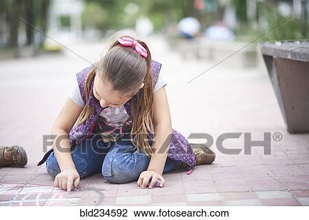 Hispanic girl drawing with chalk on sidewalk View Large Photo Image Stock Image - Hispanic girl drawing with chalk on sidewalk. Fotosearch