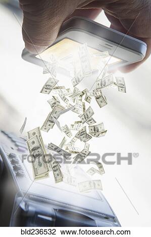 Stock Image - Hispanic man paying with smart phone. Fotosearch