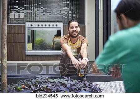 Hispanic man smiling in atrium View Large Photo Image Stock Photography - Hispanic man smiling in atrium. Fotosearch