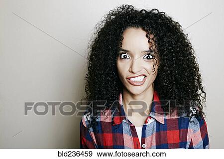 Stock Photo - Hispanic woman making a face. Fotosearch