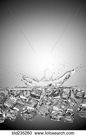 Ice cubes splashing into water and floating View Large Photo Image Stock Image - Ice cubes splashing into water and floating. Fotosearch