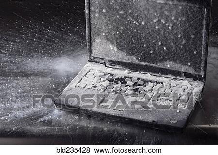 Stock Photo - Ice on frozen laptop. Fotosearch