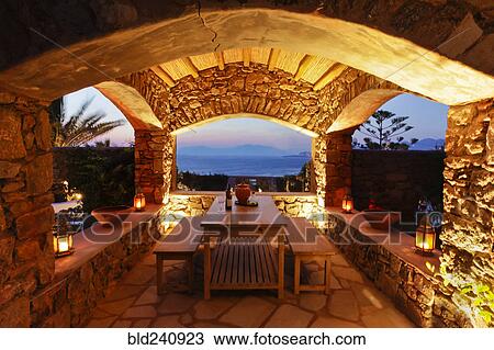 Illuminated stone patio at night View Large Photo Image Stock Image - Illuminated stone patio at night. Fotosearch