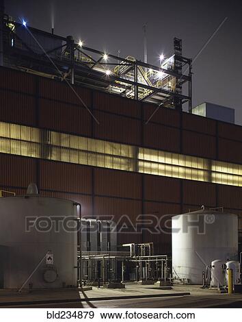 Stock Photo - Illumination on warehouse at night. Fotosearch