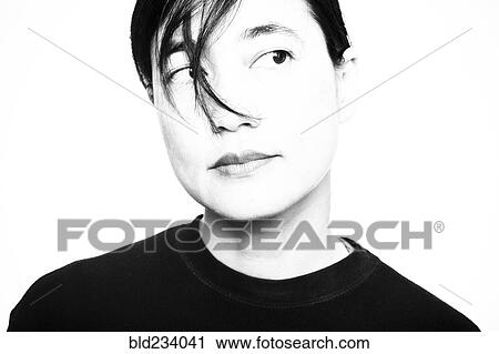 Stock Image - Japanese woman looking away. Fotosearch