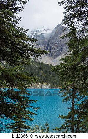Lake at foggy mountain View Large Photo Image Stock Image - Lake at foggy mountain. Fotosearch
