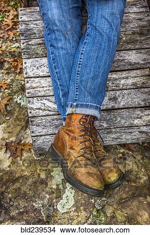 Picture - Legs of Caucasian woman wearing jeans and boots. Fotosearch