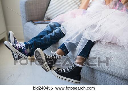 Legs of girls wearing tutus on sofa View Large Photo Image Stock Photography - Legs of girls wearing tutus on sofa. Fotosearch