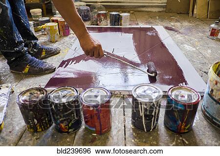 Legs of Mari man painting canvas on floor View Large Photo Image Stock Photograph - Legs of Mari man painting canvas on floor. Fotosearch