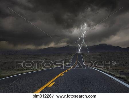 Stock Photo - Lightning striking remote highway. Fotosearch