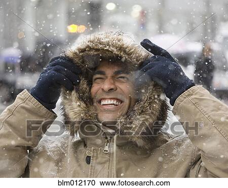 Man enjoying snow in city View Large Photo Image Stock Image - Man enjoying snow in city. Fotosearch