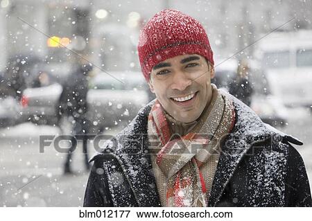 Man enjoying snow in city View Large Photo Image Stock Photo - Man enjoying snow in city. Fotosearch
