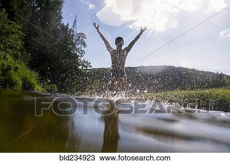 Mari man splashing in lake View Large Photo Image Stock Image - Mari man splashing in lake. Fotosearch