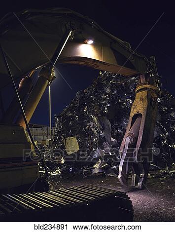 Mechanical grabber in junkyard at night View Large Photo Image Stock Image - Mechanical grabber in junkyard at night. Fotosearch