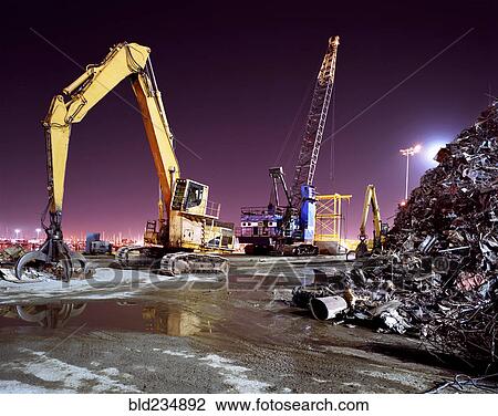 Mechanical grabber in junkyard at night View Large Photo Image Stock Image - Mechanical grabber in junkyard at night. Fotosearch