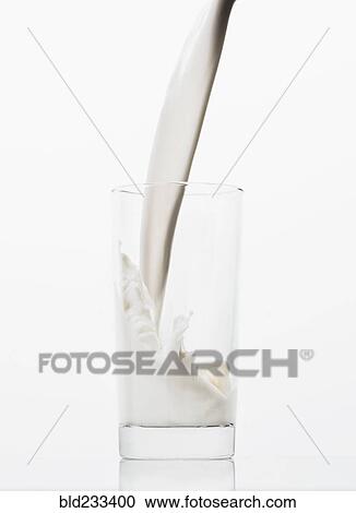 Milk pouring into glass View Large Photo Image Stock Image - Milk pouring into glass. Fotosearch
