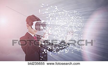 Stock Photography - Mixed Race boy wearing suit using vr goggles. Fotosearch