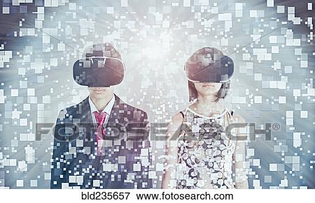 Stock Photo - Mixed Race brother and sister using vr goggles. Fotosearch
