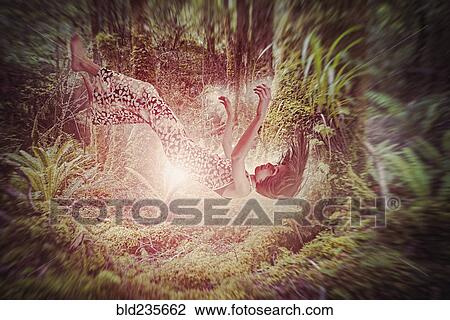 Mixed Race girl falling in glowing forest View Large Photo Image Stock Image - Mixed Race girl falling in glowing forest. Fotosearch