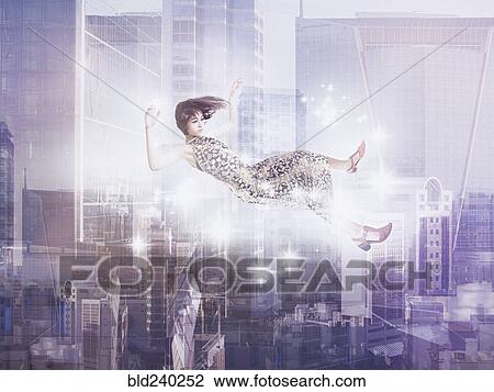 Mixed Race girl floating in city View Large Photo Image Stock Image - Mixed Race girl floating in city. Fotosearch