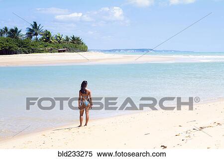 Mixed Race girl standing on beach View Large Photo Image Stock Photography - Mixed Race girl standing on beach. Fotosearch