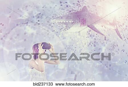 Mixed Race girl using virtual reality goggles watching shark View Large Photo Image Stock Image - Mixed Race girl using virtual reality goggles watching shark. Fotosearch