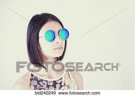 Mixed Race girl wearing blue sunglasses View Large Photo Image Stock Photo - Mixed Race girl wearing blue sunglasses. Fotosearch