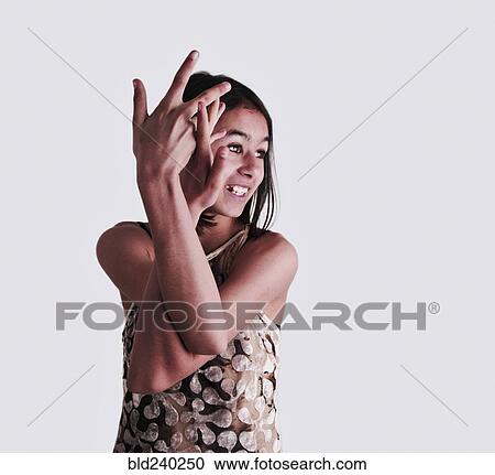 Stock Image - Mixed Race girl with intertwined arms. Fotosearch
