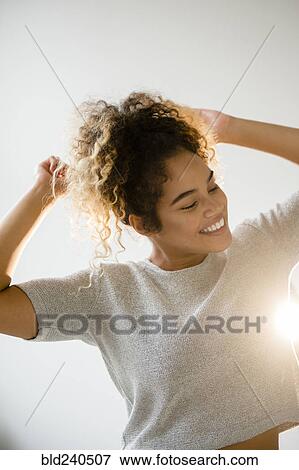 Stock Photo - Mixed Race woman dancing. Fotosearch