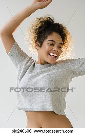 Mixed Race woman dancing View Large Photo Image Stock Photograph - Mixed Race woman dancing. Fotosearch