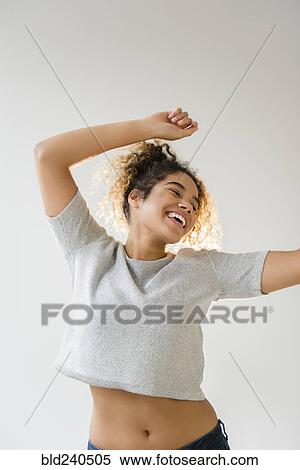 Stock Photography - Mixed Race woman dancing. Fotosearch