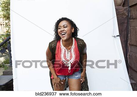 Stock Photo - Mixed Race woman laughing. Fotosearch