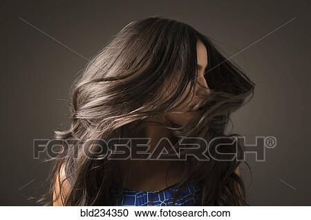 Mixed Race woman tossing hair View Large Photo Image Stock Image - Mixed Race woman tossing hair. Fotosearch