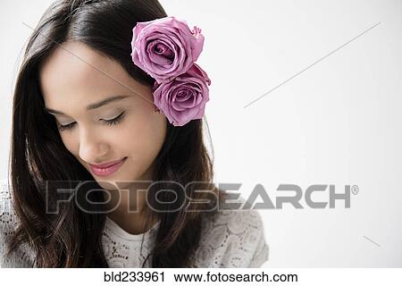Mixed Race woman with roses in hair View Large Photo Image Stock Image - Mixed Race woman with roses in hair. Fotosearch