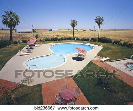Motel swimming pool near freeway View Large Photo Image Stock Photo - Motel swimming pool near freeway. Fotosearch