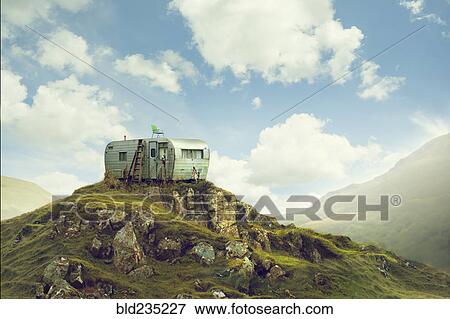 Motor home on hill in green landscape View Large Photo Image Stock Photo - Motor home on hill in green landscape. Fotosearch