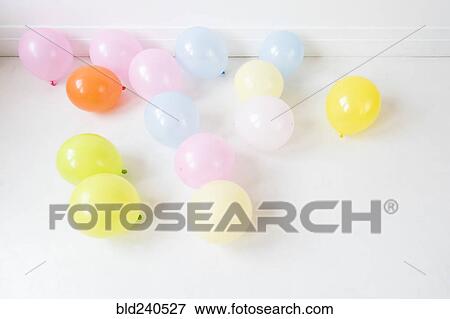 Multicolor balloons on white floor View Large Photo Image Stock Photo - Multicolor balloons on white floor. Fotosearch