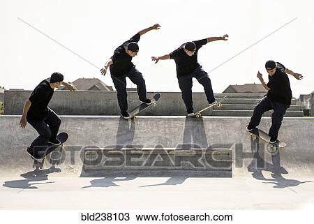 Stock Image - Multiple exposure of Caucasian man riding skateboard in skate park. Fotosearch