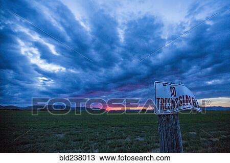 No trespassing sign under clouds at sunset View Large Photo Image Stock Image - No trespassing sign under clouds at sunset. Fotosearch