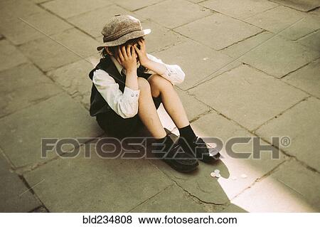 Old-fashioned Caucasian sitting in street crying View Large Photo Image Stock Photo - Old-fashioned Caucasian sitting in street crying. Fotosearch