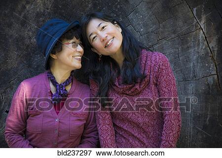 Older Japanese mother and daughter posing at tree slice View Large Photo Image Stock Photo - Older Japanese mother and daughter posing at tree slice. Fotosearch